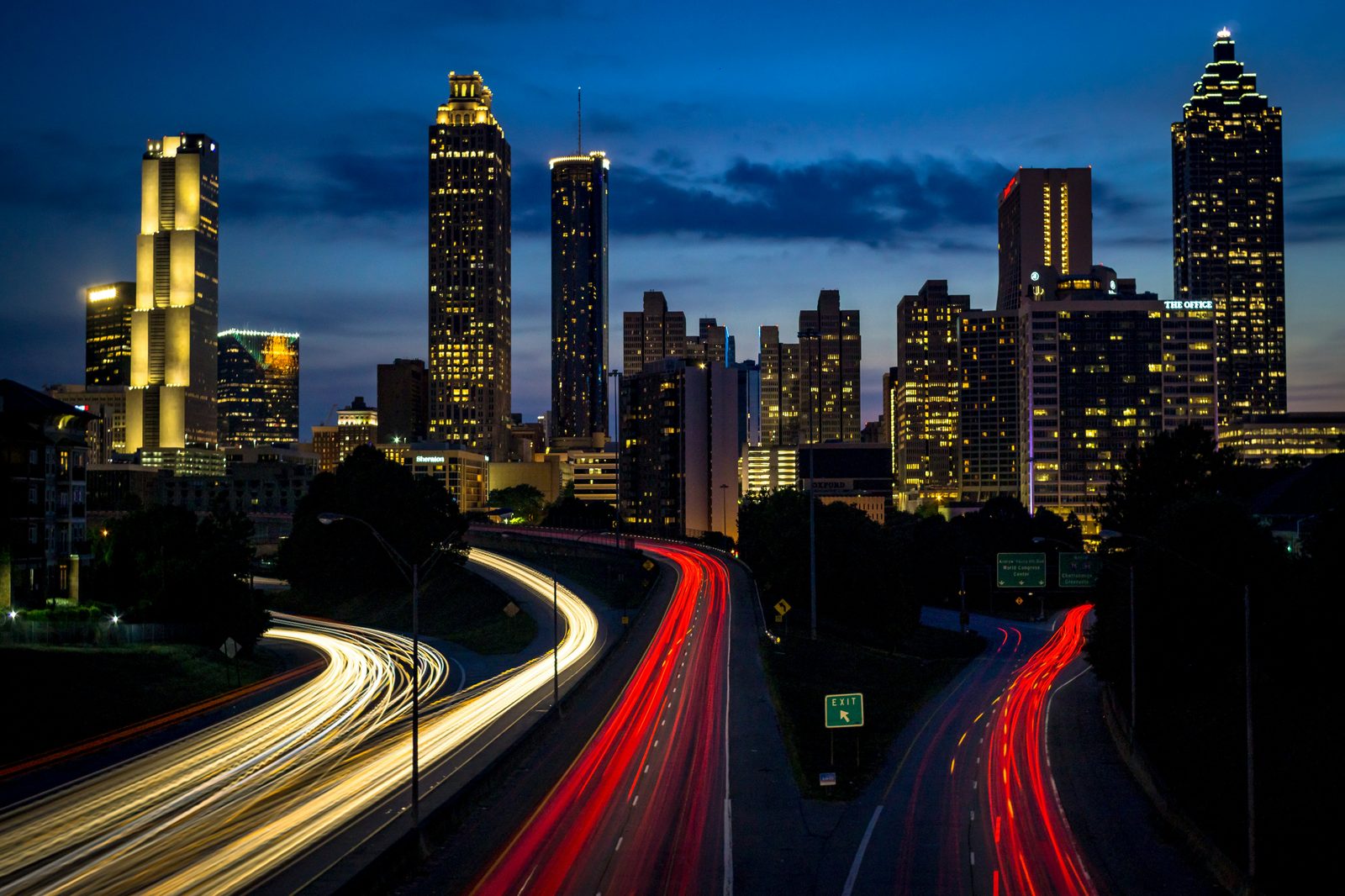 Atlanta skyline at night with light trails from traffic below